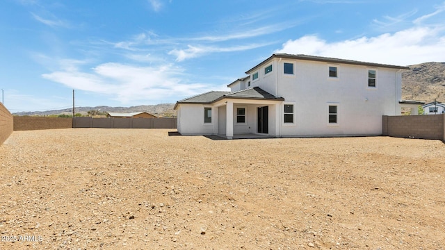 2316 W Moody Trl, Phoenix, AZ 85041 - rear view of property with a fenced backyard, a mountain view, a patio area, and stucco siding