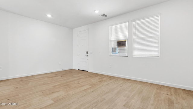 2316 W Moody Trl, Phoenix, AZ 85041 - spare room with baseboards, light wood finished floors, and recessed lighting