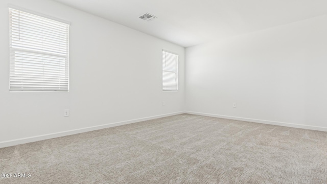 2316 W Moody Trl, Phoenix, AZ 85041 - spare room featuring baseboards and light colored carpet