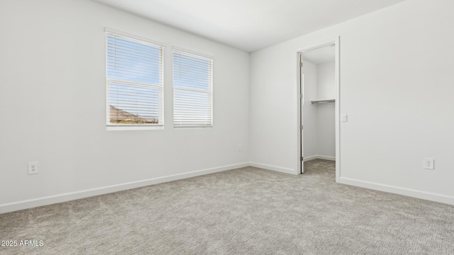 2316 W Moody Trl, Phoenix, AZ 85041 - unfurnished bedroom with carpet flooring, baseboards, a spacious closet, and a closet