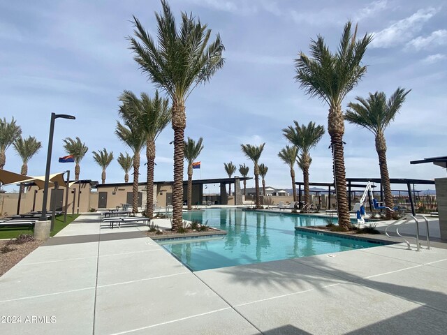 view of swimming pool with a patio area