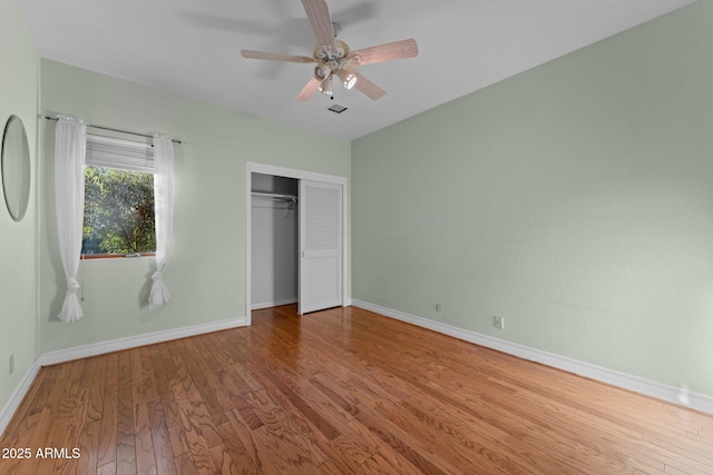 1503 N Thrasher Ln, Wickenburg, AZ 85390 - unfurnished bedroom with wood finished floors, a closet, and ceiling fan