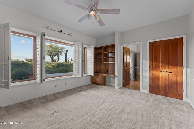 1503 N Thrasher Ln, Wickenburg, AZ 85390 - unfurnished bedroom with carpet flooring and a ceiling fan