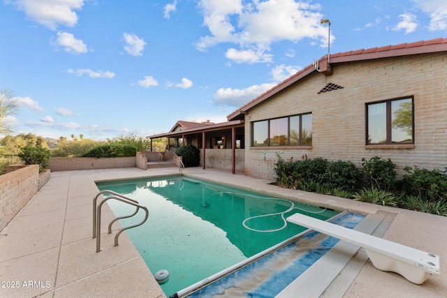 1503 N Thrasher Ln, Wickenburg, AZ 85390 - view of pool with a patio area, a diving board, and a fenced backyard