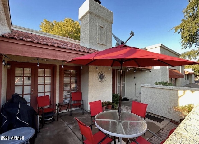 view of patio featuring french doors