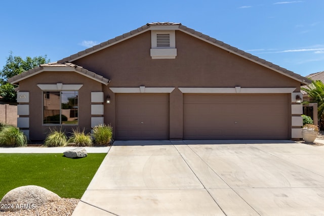 view of front of property with a garage