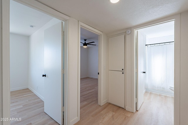 4740 E Portland St, Phoenix, AZ 85008 - corridor featuring light wood-style flooring and baseboards