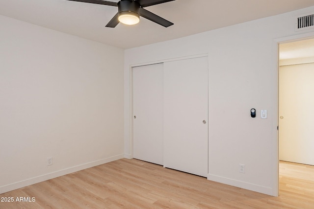 4740 E Portland St, Phoenix, AZ 85008 - unfurnished bedroom featuring light wood finished floors, baseboards, visible vents, and a closet