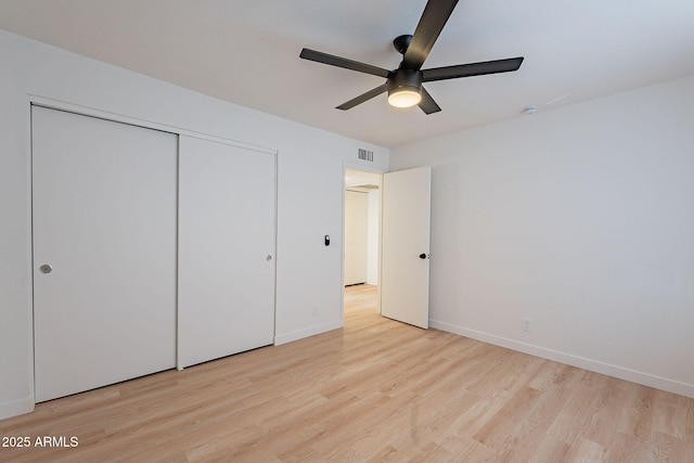 4740 E Portland St, Phoenix, AZ 85008 - unfurnished bedroom with visible vents, baseboards, wood finished floors, a closet, and ceiling fan