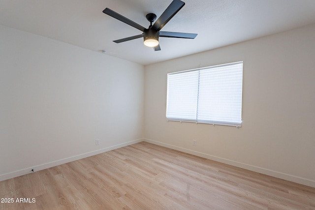 4740 E Portland St, Phoenix, AZ 85008 - empty room featuring baseboards, a ceiling fan, and light wood-style floors