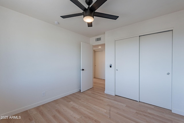 4740 E Portland St, Phoenix, AZ 85008 - unfurnished bedroom with baseboards, a closet, visible vents, and light wood-type flooring