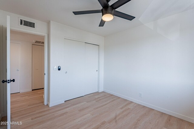 4740 E Portland St, Phoenix, AZ 85008 - unfurnished bedroom featuring baseboards, a closet, visible vents, and light wood-style flooring