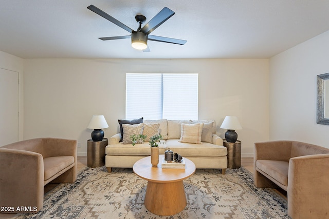 4740 E Portland St, Phoenix, AZ 85008 - living area featuring wood finished floors, a ceiling fan, and baseboards