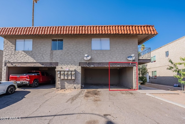 4740 E Portland St, Phoenix, AZ 85008 - view of front facade featuring stucco siding and a garage