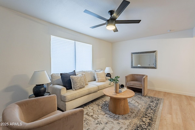 4740 E Portland St, Phoenix, AZ 85008 - living area with baseboards, a ceiling fan, and light wood-style floors