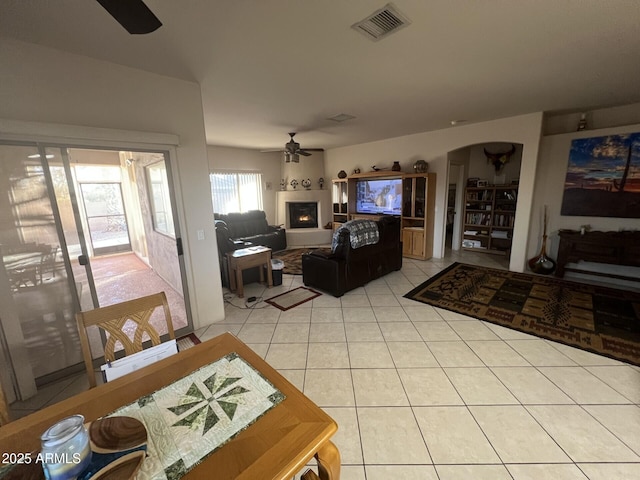 living room featuring ceiling fan and light tile patterned floors