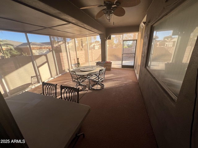 sunroom / solarium with ceiling fan