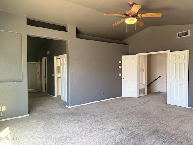 unfurnished bedroom with visible vents, a ceiling fan, carpet, and high vaulted ceiling