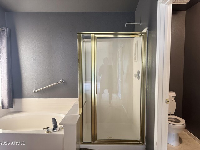 full bath with tile patterned floors, toilet, a shower stall, and a bath