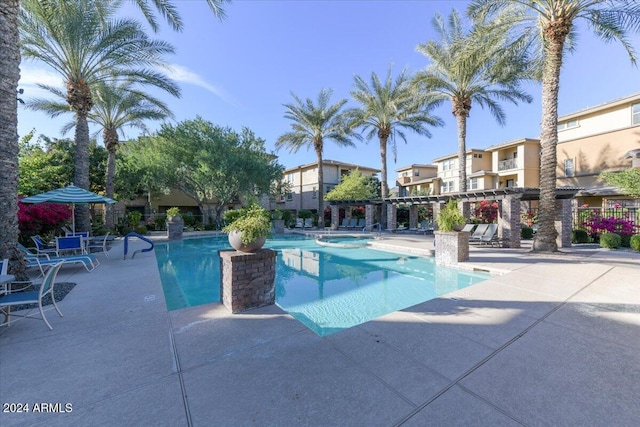 view of pool featuring a patio area and a jacuzzi