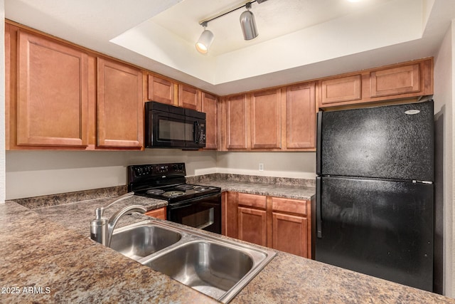 1331 W Baseline Rd Unit 167, Mesa, AZ 85202 - kitchen featuring black appliances, a raised ceiling, brown cabinets, and dark countertops