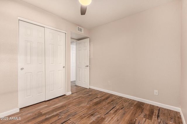 1331 W Baseline Rd Unit 167, Mesa, AZ 85202 - unfurnished bedroom featuring wood finished floors, a closet, and a ceiling fan
