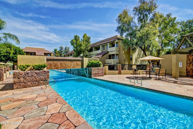 1331 W Baseline Rd Unit 167, Mesa, AZ 85202 - view of pool featuring exterior kitchen and a patio area