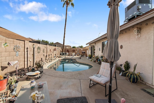 view of swimming pool featuring a patio area