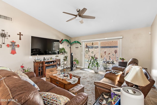 living room with ceiling fan and lofted ceiling