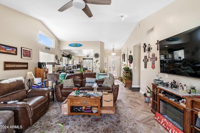 living room with high vaulted ceiling and ceiling fan