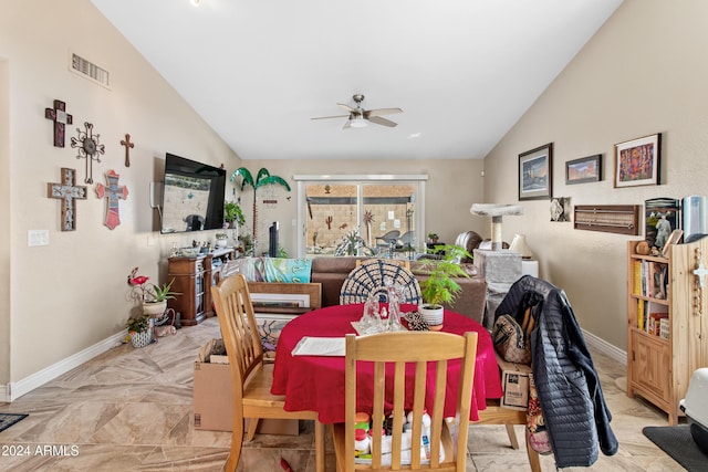 dining space featuring ceiling fan and lofted ceiling