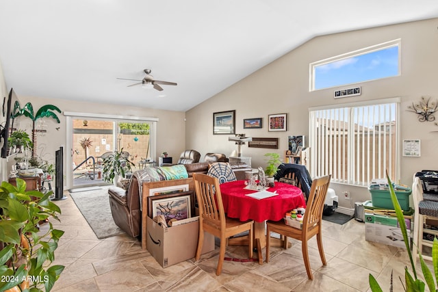 dining area with ceiling fan, plenty of natural light, and vaulted ceiling