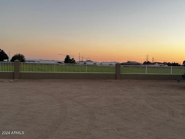 view of yard at dusk