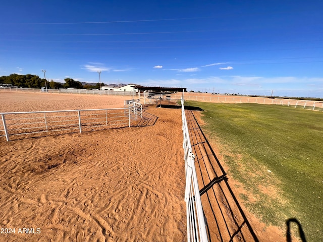 view of yard with a rural view