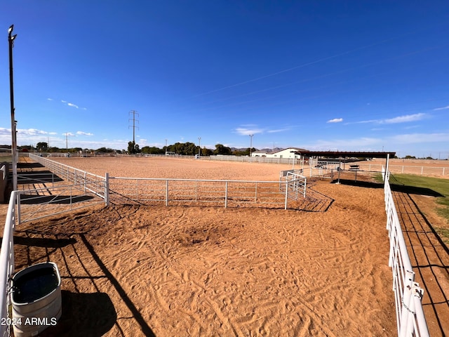 view of yard with a rural view