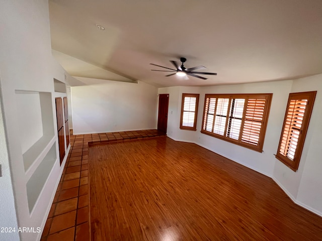 empty room with ceiling fan and hardwood / wood-style floors