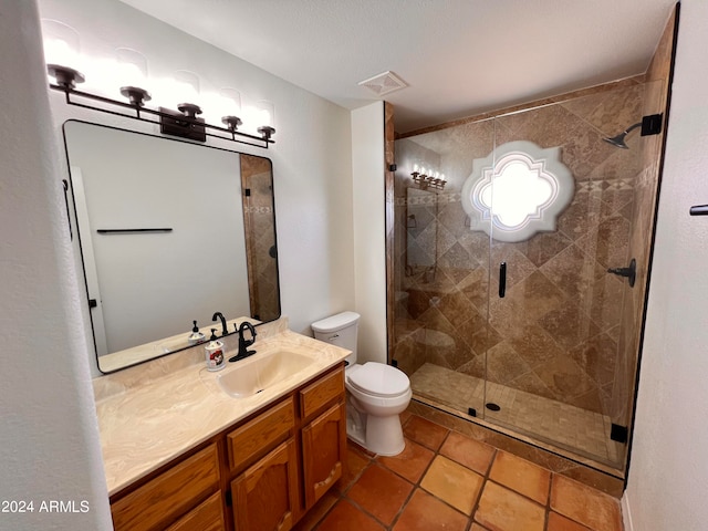 bathroom with tile patterned floors, toilet, vanity, a textured ceiling, and an enclosed shower