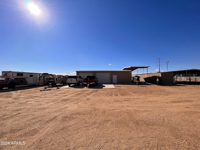 view of yard with an outdoor structure and a garage