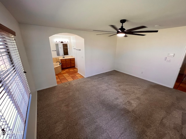 interior space featuring ceiling fan