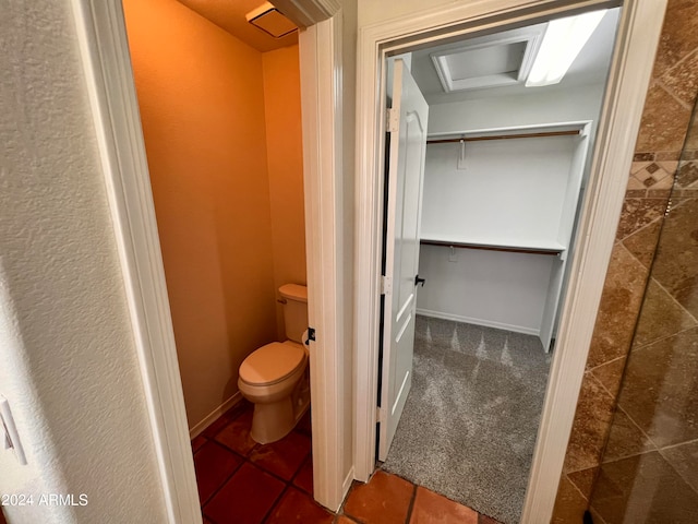 bathroom with toilet and tile patterned floors