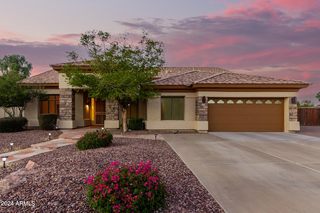 prairie-style home featuring a garage