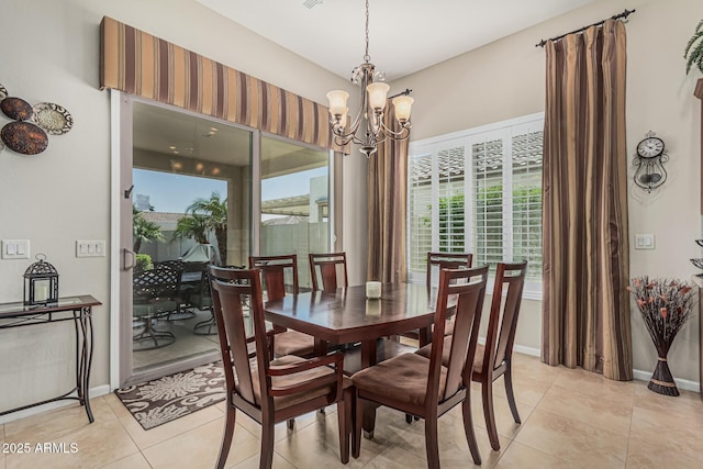 16747 W Berkeley Rd, Goodyear, AZ 85395 - dining space featuring a chandelier, light tile patterned floors, and baseboards