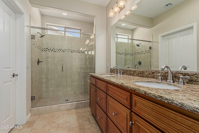 16747 W Berkeley Rd, Goodyear, AZ 85395 - full bathroom featuring a shower stall, double vanity, and tile patterned flooring