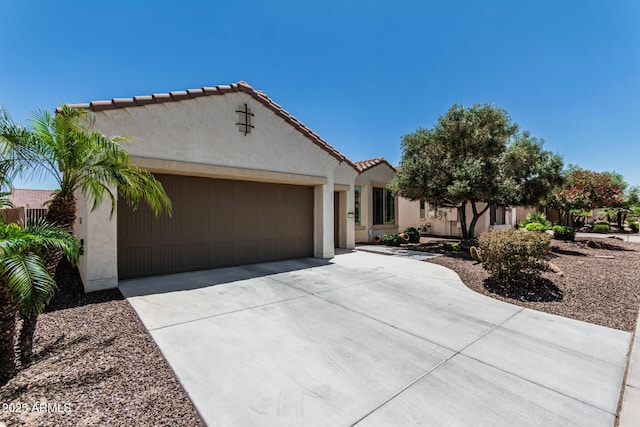 16747 W Berkeley Rd, Goodyear, AZ 85395 - mediterranean / spanish-style house with stucco siding, driveway, a garage, and a tile roof