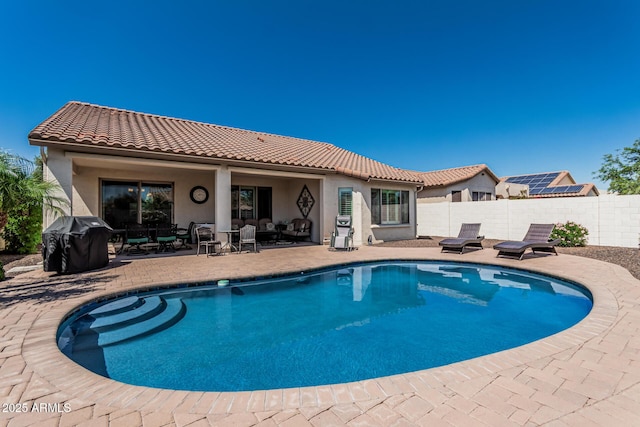 16747 W Berkeley Rd, Goodyear, AZ 85395 - view of swimming pool featuring a grill, a patio, fence, and outdoor lounge area