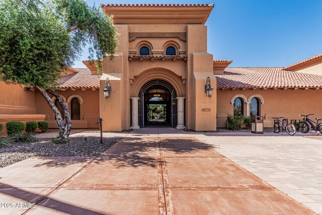 16747 W Berkeley Rd, Goodyear, AZ 85395 - property entrance with stucco siding, a tiled roof, and driveway