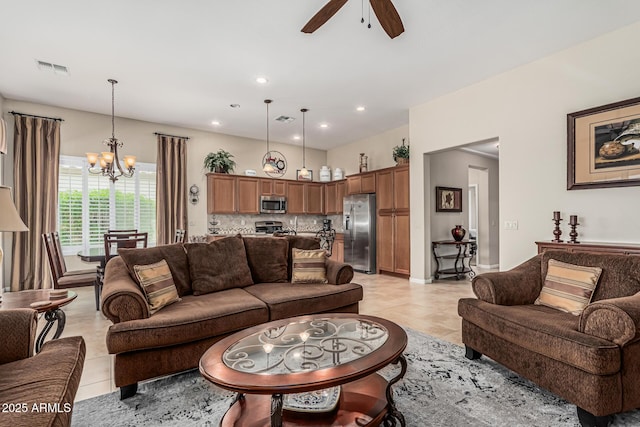 16747 W Berkeley Rd, Goodyear, AZ 85395 - living room featuring a chandelier, ceiling fan, light tile patterned flooring, recessed lighting, and baseboards