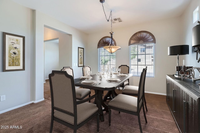 1710 S Parkcrest St, Gilbert, AZ 85295 - dining area with dark carpet and baseboards