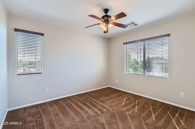 1710 S Parkcrest St, Gilbert, AZ 85295 - spare room featuring dark colored carpet, baseboards, and ceiling fan