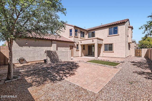 1710 S Parkcrest St, Gilbert, AZ 85295 - back of property featuring stucco siding, a tiled roof, a fenced backyard, and a patio